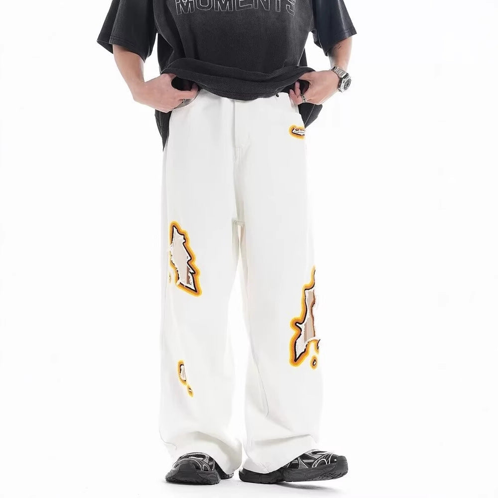Jeans with hole patches and embroidery Colouronova