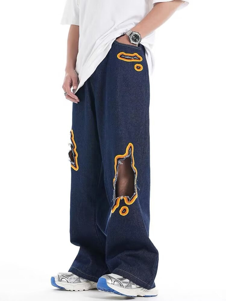 Jeans with hole patches and embroidery Colouronova