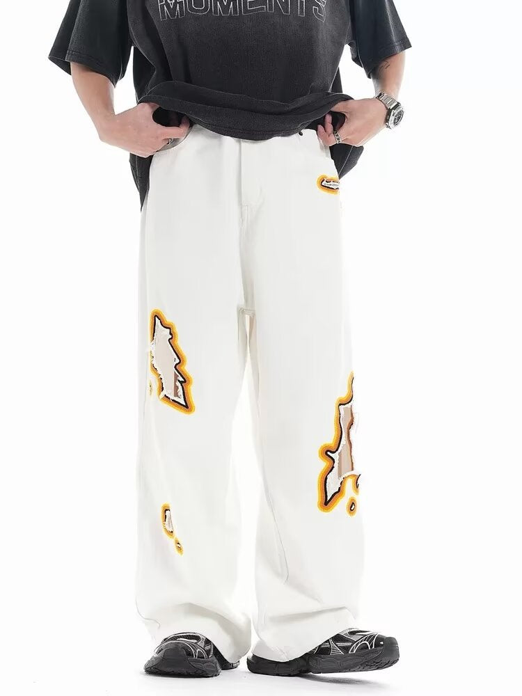 Jeans with hole patches and embroidery Colouronova