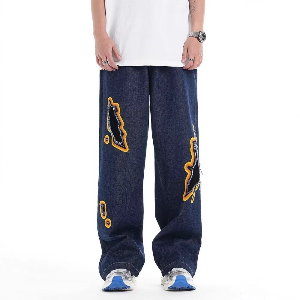 Jeans with hole patches and embroidery Colouronova